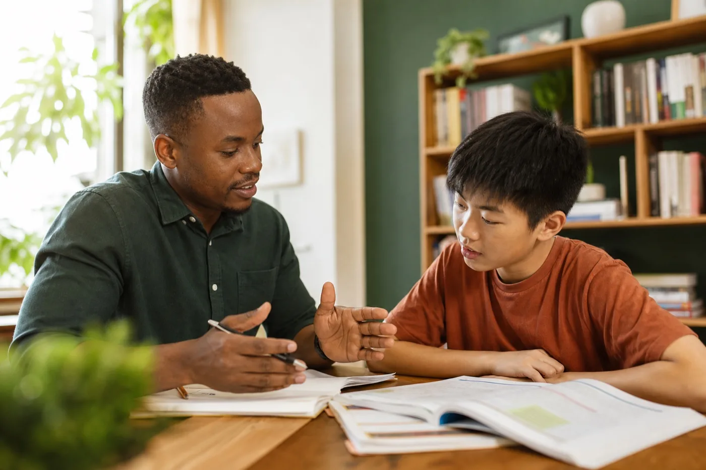 A tutor supporting a student in a one-to-one lesson